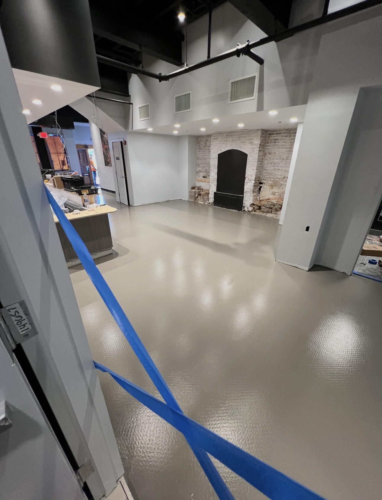 Tan textured coating system installed in a restaurant dining room