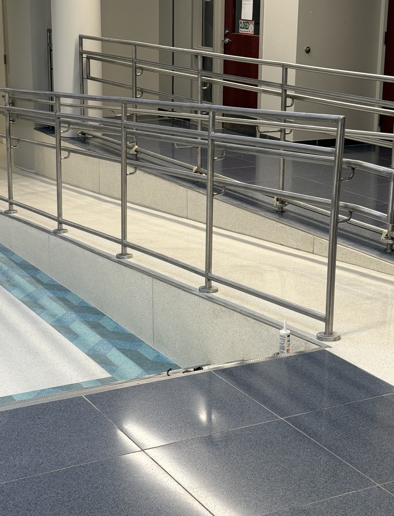 Multi-color terrazzo flooring and accessible ramp in a public building